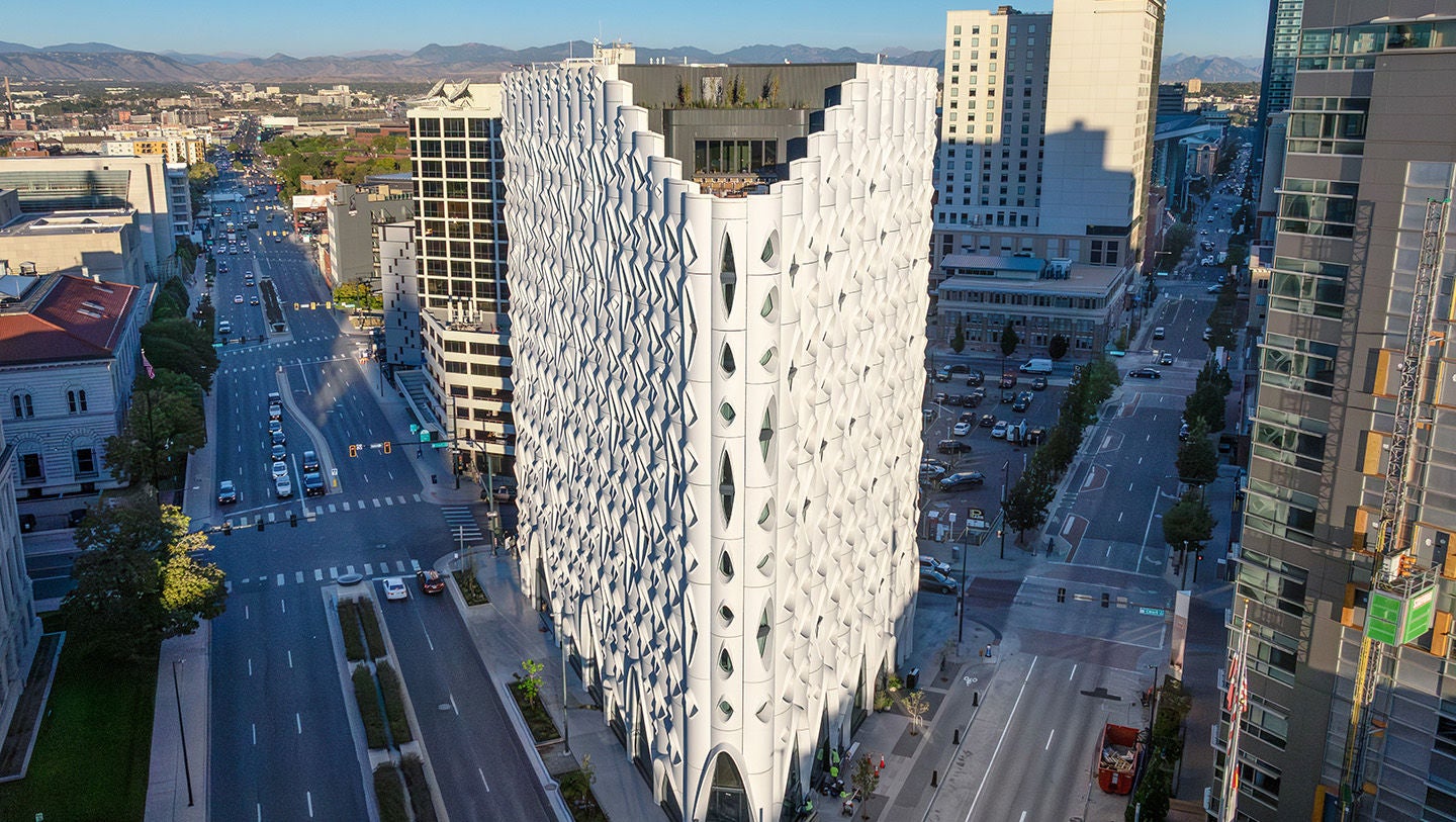 Cityscape centered on corner view of modern white highrise