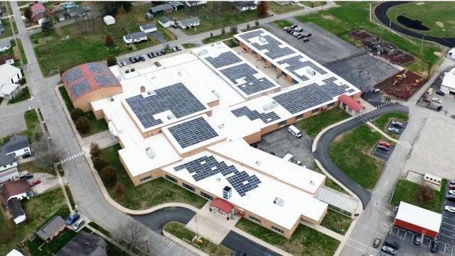 Aerial shot of sprawling facility with solar panels