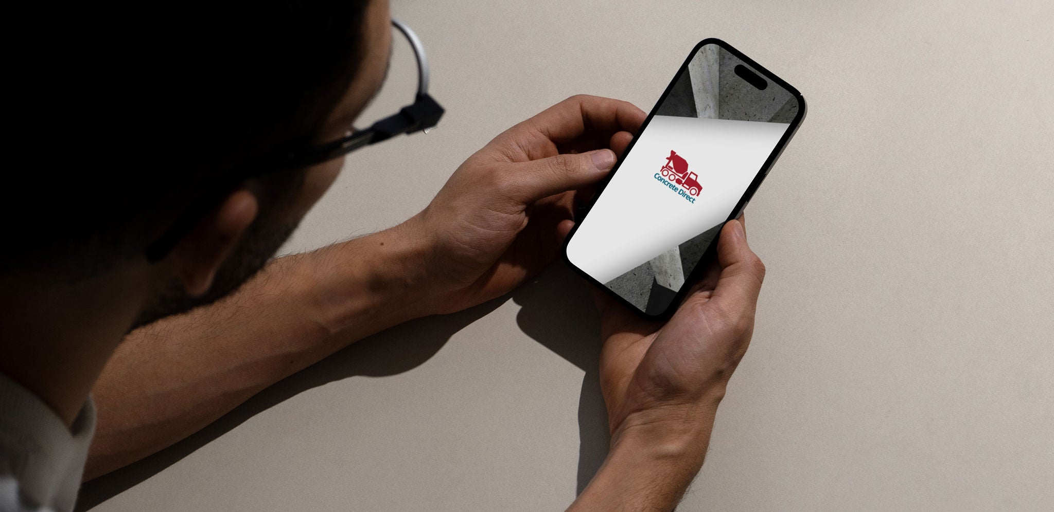 A person viewing Concrete Direct on their smartphone