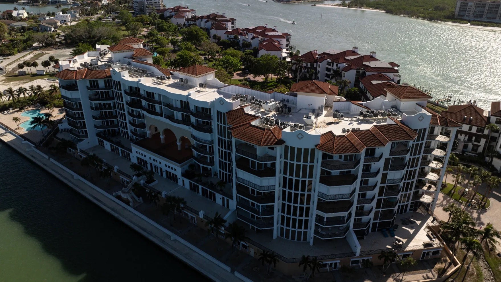 The Twin Dolphins Condominiums with several residential buildings surrounded by waterways